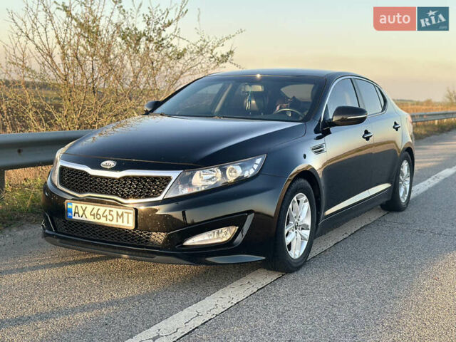 Черный Киа K5, объемом двигателя 2 л и пробегом 256 тыс. км за 9000 $, фото 1 на Automoto.ua