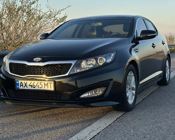 Черный Киа K5, объемом двигателя 2 л и пробегом 256 тыс. км за 9000 $, фото 14 на Automoto.ua