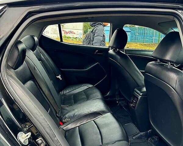 Черный Киа K5, объемом двигателя 2 л и пробегом 324 тыс. км за 9250 $, фото 1 на Automoto.ua