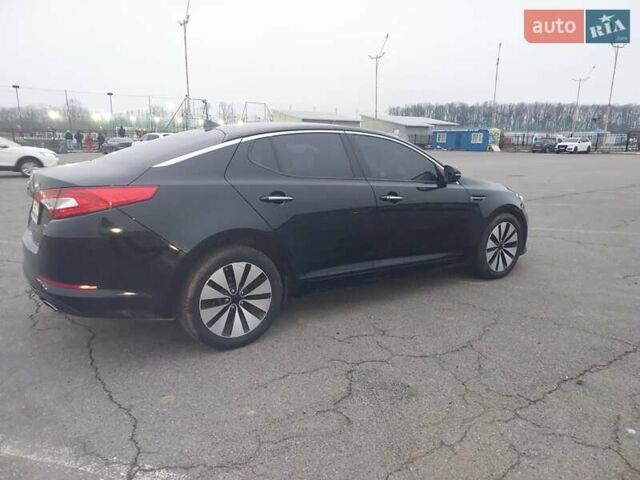Черный Киа K5, объемом двигателя 2 л и пробегом 281 тыс. км за 11200 $, фото 2 на Automoto.ua