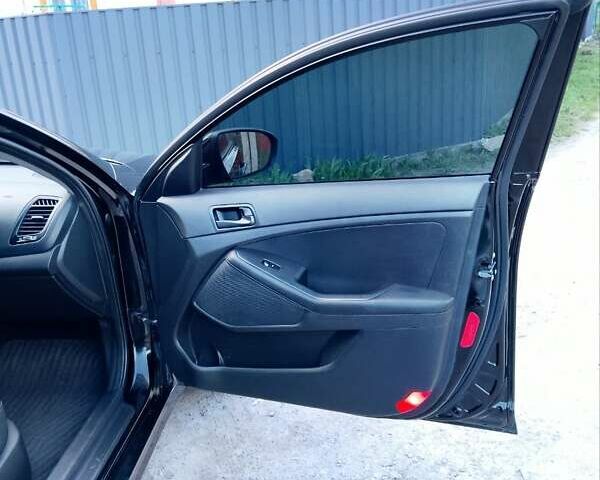 Черный Киа K5, объемом двигателя 2 л и пробегом 200 тыс. км за 9200 $, фото 5 на Automoto.ua