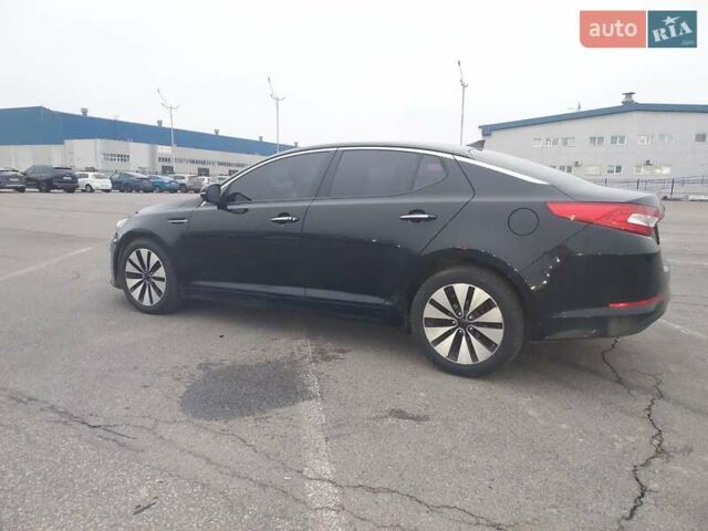 Черный Киа K5, объемом двигателя 2 л и пробегом 281 тыс. км за 11200 $, фото 1 на Automoto.ua