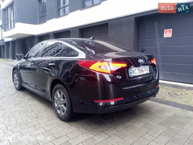 Черный Киа K5, объемом двигателя 2 л и пробегом 255 тыс. км за 9750 $, фото 6 на Automoto.ua