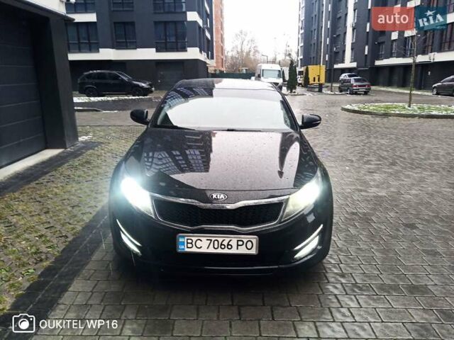 Черный Киа K5, объемом двигателя 2 л и пробегом 255 тыс. км за 9750 $, фото 3 на Automoto.ua