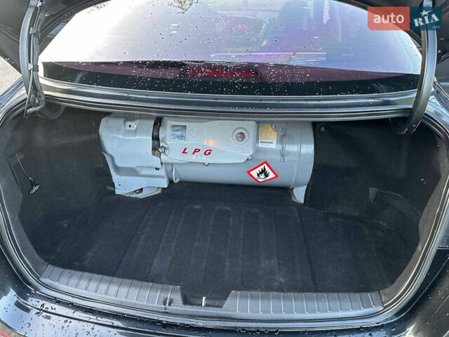 Черный Киа K5, объемом двигателя 2 л и пробегом 136 тыс. км за 8600 $, фото 11 на Automoto.ua