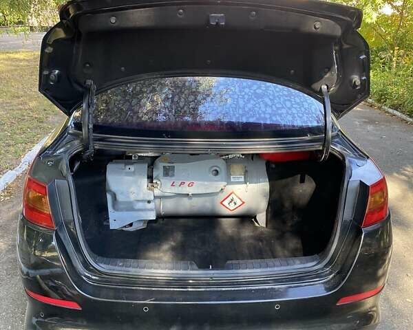 Чорний Кіа K5, об'ємом двигуна 2 л та пробігом 209 тис. км за 8200 $, фото 9 на Automoto.ua