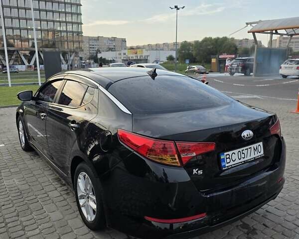 Черный Киа K5, объемом двигателя 2 л и пробегом 408 тыс. км за 6400 $, фото 1 на Automoto.ua