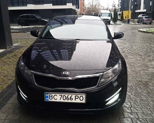 Черный Киа K5, объемом двигателя 2 л и пробегом 255 тыс. км за 9750 $, фото 1 на Automoto.ua