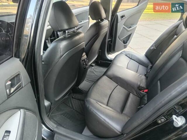 Черный Киа K5, объемом двигателя 2 л и пробегом 287 тыс. км за 7700 $, фото 2 на Automoto.ua
