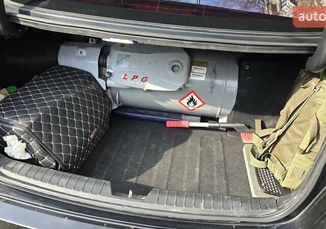 Черный Киа K5, объемом двигателя 2 л и пробегом 440 тыс. км за 8900 $, фото 21 на Automoto.ua