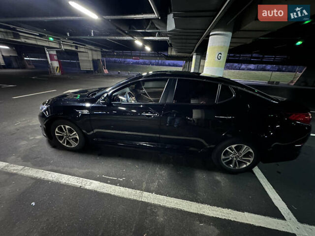 Черный Киа K5, объемом двигателя 2 л и пробегом 121 тыс. км за 11999 $, фото 1 на Automoto.ua