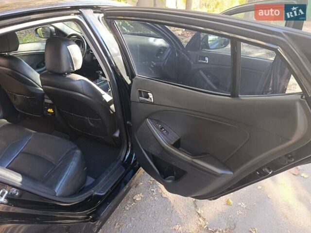 Черный Киа K5, объемом двигателя 2 л и пробегом 131 тыс. км за 12000 $, фото 10 на Automoto.ua