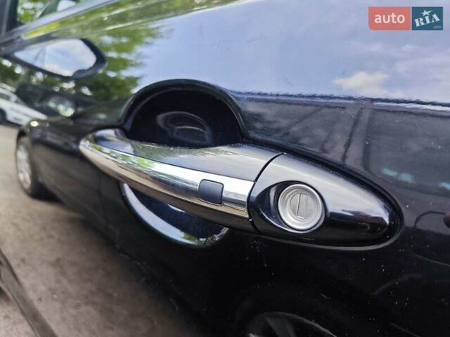 Черный Киа K5, объемом двигателя 2 л и пробегом 209 тыс. км за 11990 $, фото 26 на Automoto.ua