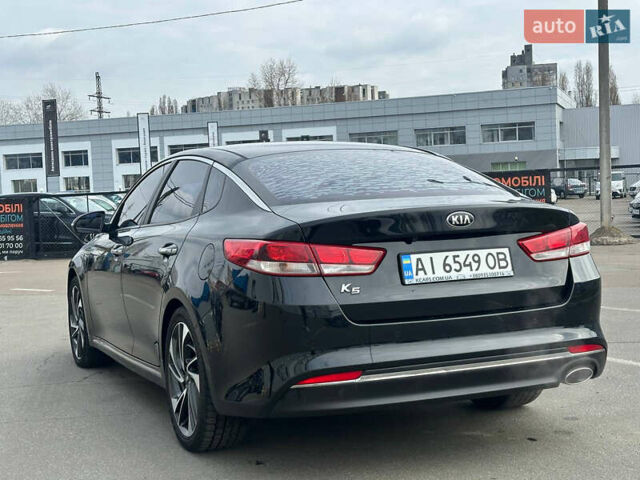 Черный Киа K5, объемом двигателя 2 л и пробегом 90 тыс. км за 10500 $, фото 1 на Automoto.ua