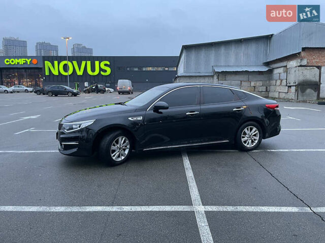 Черный Киа K5, объемом двигателя 2 л и пробегом 230 тыс. км за 13499 $, фото 1 на Automoto.ua
