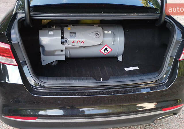 Чорний Кіа K5, об'ємом двигуна 2 л та пробігом 258 тис. км за 13500 $, фото 2 на Automoto.ua