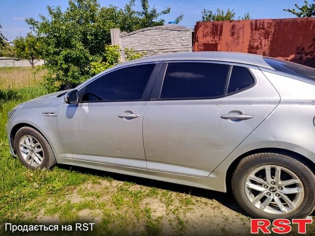 Серый Киа K5, объемом двигателя 2 л и пробегом 248 тыс. км за 7500 $, фото 1 на Automoto.ua