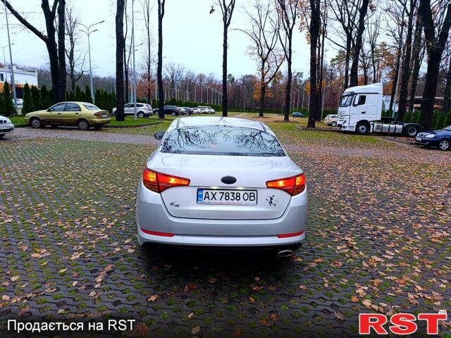 Серый Киа K5, объемом двигателя 2 л и пробегом 405 тыс. км за 7500 $, фото 3 на Automoto.ua