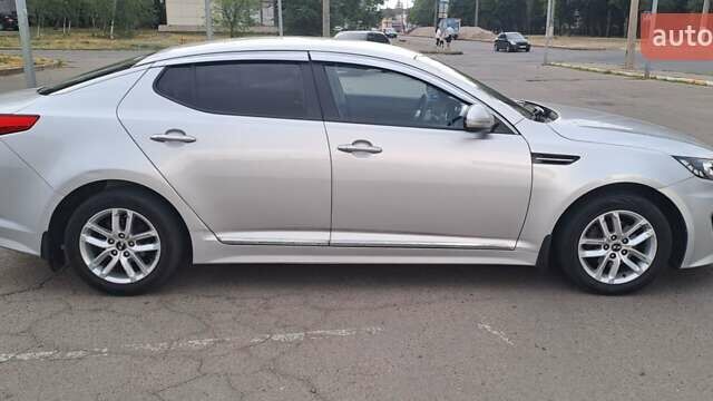 Серый Киа K5, объемом двигателя 2 л и пробегом 316 тыс. км за 7700 $, фото 7 на Automoto.ua