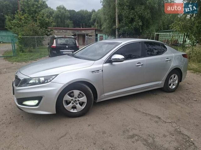 Серый Киа K5, объемом двигателя 2 л и пробегом 350 тыс. км за 7750 $, фото 1 на Automoto.ua