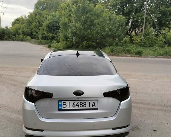 Серый Киа K5, объемом двигателя 2 л и пробегом 328 тыс. км за 9300 $, фото 1 на Automoto.ua