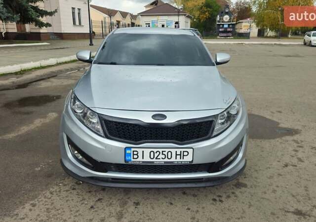 Серый Киа K5, объемом двигателя 2 л и пробегом 249 тыс. км за 8700 $, фото 2 на Automoto.ua