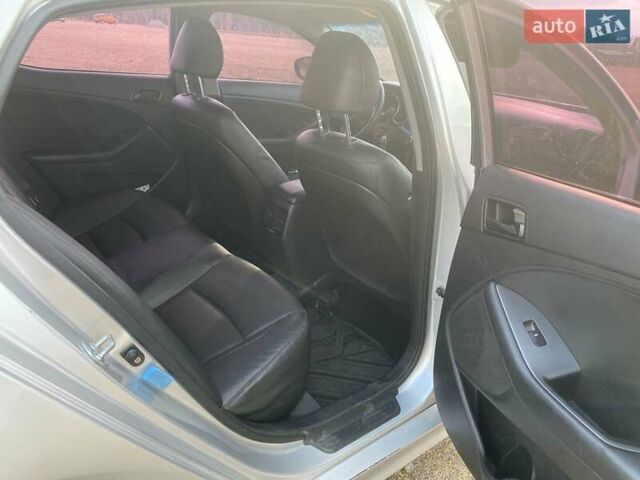 Серый Киа K5, объемом двигателя 2 л и пробегом 456 тыс. км за 8500 $, фото 6 на Automoto.ua