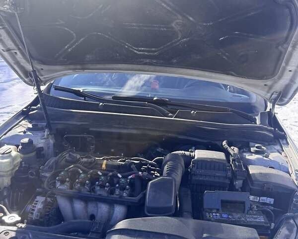 Серый Киа K5, объемом двигателя 2 л и пробегом 451 тыс. км за 7898 $, фото 37 на Automoto.ua