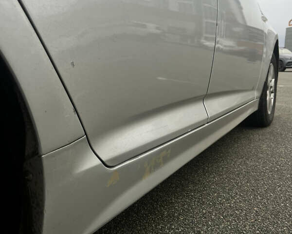 Серый Киа K5, объемом двигателя 2 л и пробегом 246 тыс. км за 7600 $, фото 12 на Automoto.ua