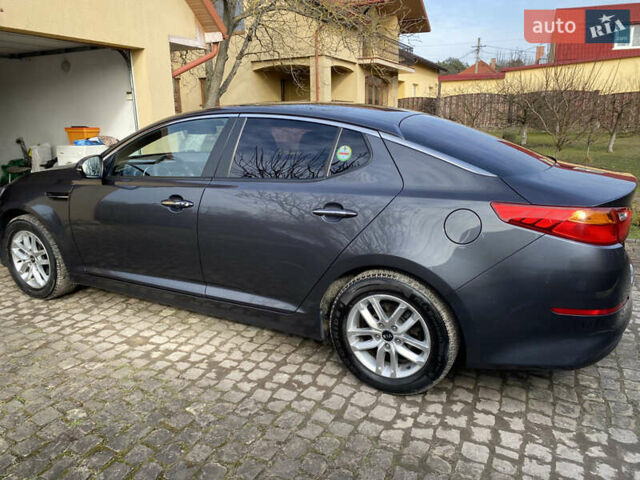 Серый Киа K5, объемом двигателя 2 л и пробегом 208 тыс. км за 10550 $, фото 15 на Automoto.ua