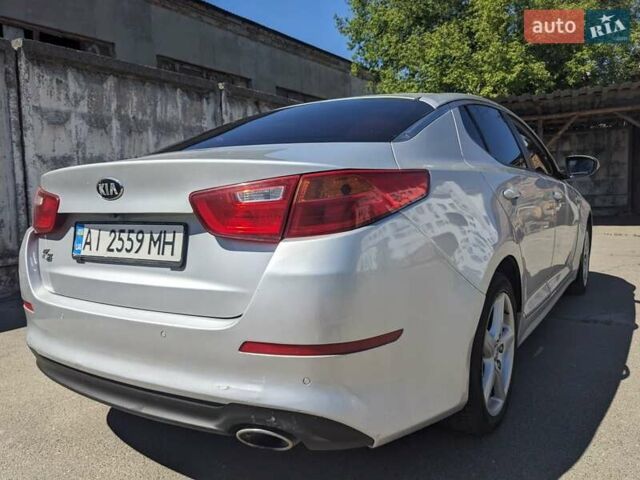 Серый Киа K5, объемом двигателя 2 л и пробегом 306 тыс. км за 9900 $, фото 1 на Automoto.ua