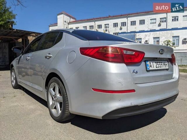 Серый Киа K5, объемом двигателя 2 л и пробегом 306 тыс. км за 9900 $, фото 2 на Automoto.ua