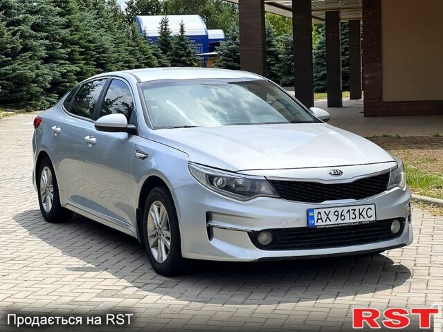Серый Киа K5, объемом двигателя 2 л и пробегом 200 тыс. км за 9600 $, фото 3 на Automoto.ua