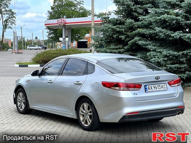 Серый Киа K5, объемом двигателя 2 л и пробегом 200 тыс. км за 9600 $, фото 6 на Automoto.ua
