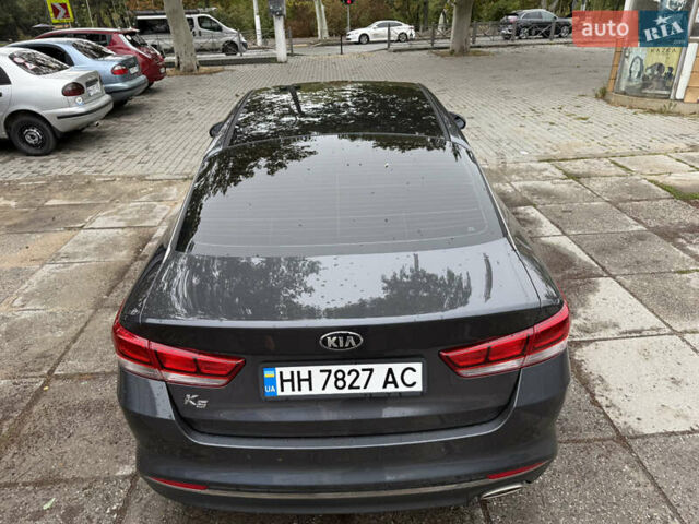 Серый Киа K5, объемом двигателя 2 л и пробегом 153 тыс. км за 13500 $, фото 6 на Automoto.ua