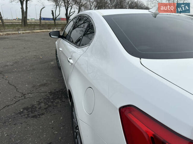 Белый Киа K7, объемом двигателя 3 л и пробегом 235 тыс. км за 11699 $, фото 15 на Automoto.ua