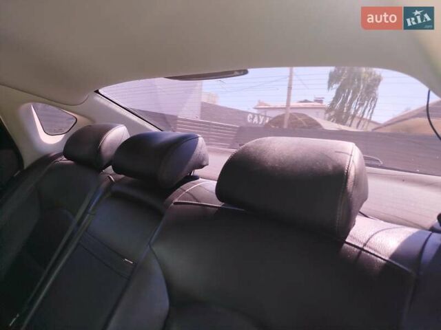 Черный Киа K7, объемом двигателя 3 л и пробегом 233 тыс. км за 14500 $, фото 17 на Automoto.ua