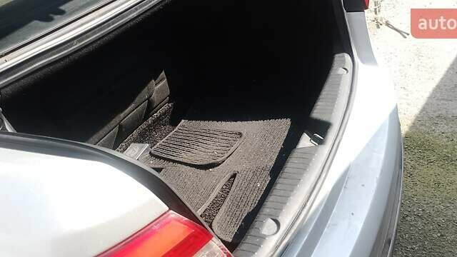 Серый Киа K7, объемом двигателя 3 л и пробегом 215 тыс. км за 7980 $, фото 1 на Automoto.ua