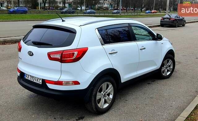 Білий Кіа Sportage, об'ємом двигуна 2 л та пробігом 102 тис. км за 14700 $, фото 14 на Automoto.ua