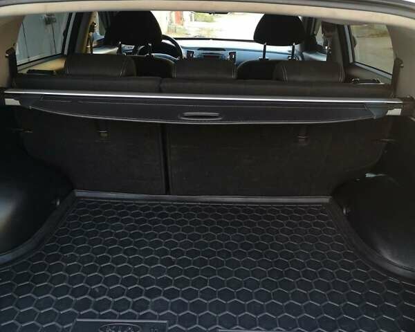 Білий Кіа Sportage, об'ємом двигуна 2 л та пробігом 198 тис. км за 12900 $, фото 24 на Automoto.ua