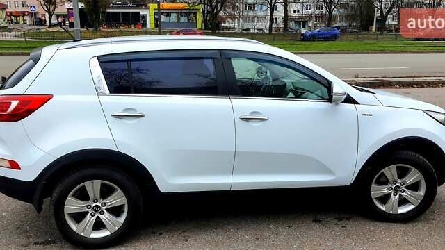 Білий Кіа Sportage, об'ємом двигуна 2 л та пробігом 102 тис. км за 14700 $, фото 15 на Automoto.ua