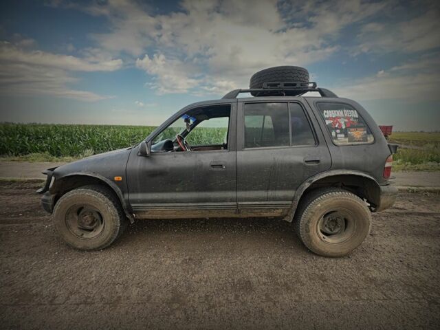 Черный Киа Sportage, объемом двигателя 2 л и пробегом 240 тыс. км за 2000 $, фото 3 на Automoto.ua