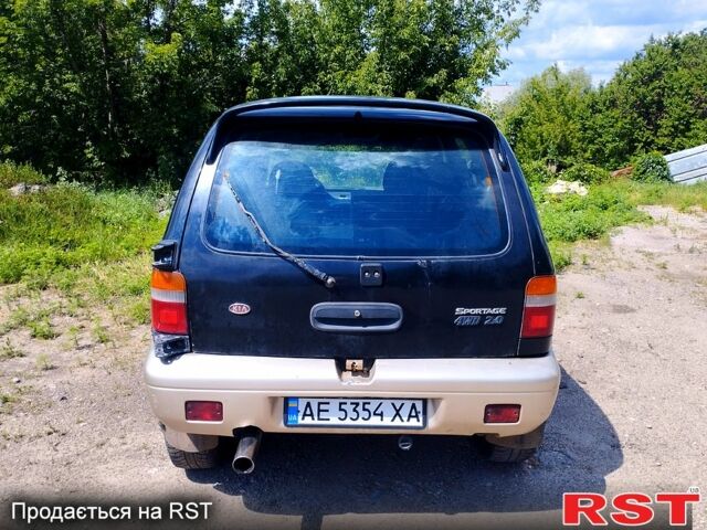Черный Киа Sportage, объемом двигателя 2 л и пробегом 50 тыс. км за 1500 $, фото 5 на Automoto.ua