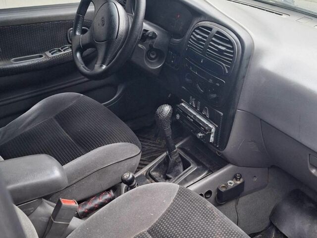 Черный Киа Sportage, объемом двигателя 2 л и пробегом 220 тыс. км за 2000 $, фото 5 на Automoto.ua