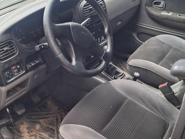 Черный Киа Sportage, объемом двигателя 2 л и пробегом 220 тыс. км за 2000 $, фото 1 на Automoto.ua