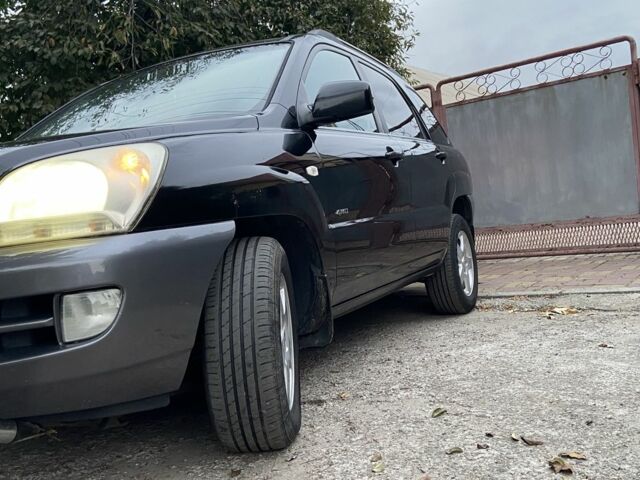 Чорний Кіа Sportage, об'ємом двигуна 2 л та пробігом 227 тис. км за 6900 $, фото 2 на Automoto.ua