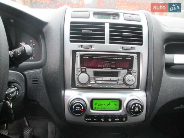 Черный Киа Sportage, объемом двигателя 2 л и пробегом 213 тыс. км за 7700 $, фото 12 на Automoto.ua