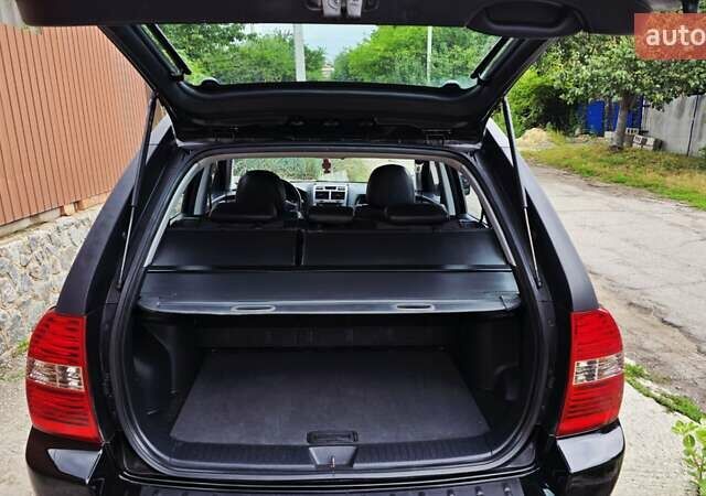 Чорний Кіа Sportage, об'ємом двигуна 2 л та пробігом 172 тис. км за 7999 $, фото 60 на Automoto.ua