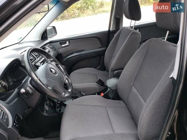 Чорний Кіа Sportage, об'ємом двигуна 2 л та пробігом 150 тис. км за 7000 $, фото 31 на Automoto.ua