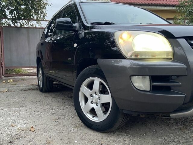 Чорний Кіа Sportage, об'ємом двигуна 2 л та пробігом 227 тис. км за 6900 $, фото 1 на Automoto.ua